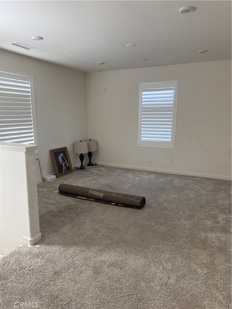 467 West Buttercup Lane Rialto, CA 92376 - Photo 6 of 13 a bedroom with a bed and window