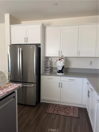 a kitchen with a refrigerator and a sink