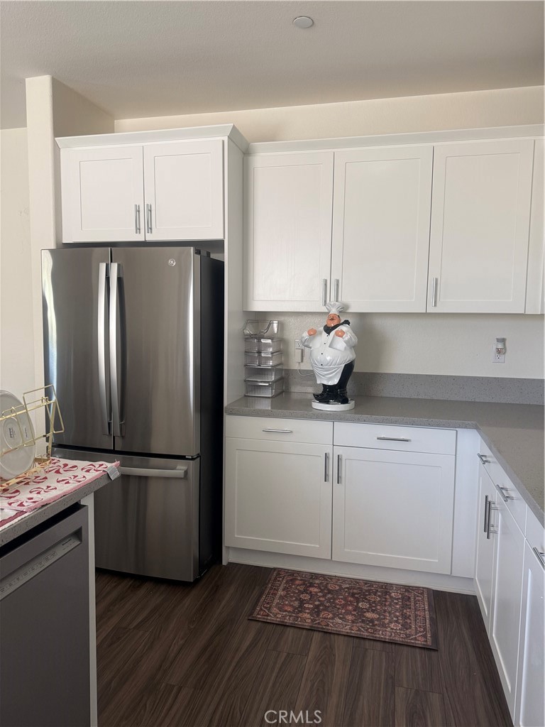 467 West Buttercup Lane Rialto, CA 92376 - Photo 9 of 13 a kitchen with a refrigerator and a sink