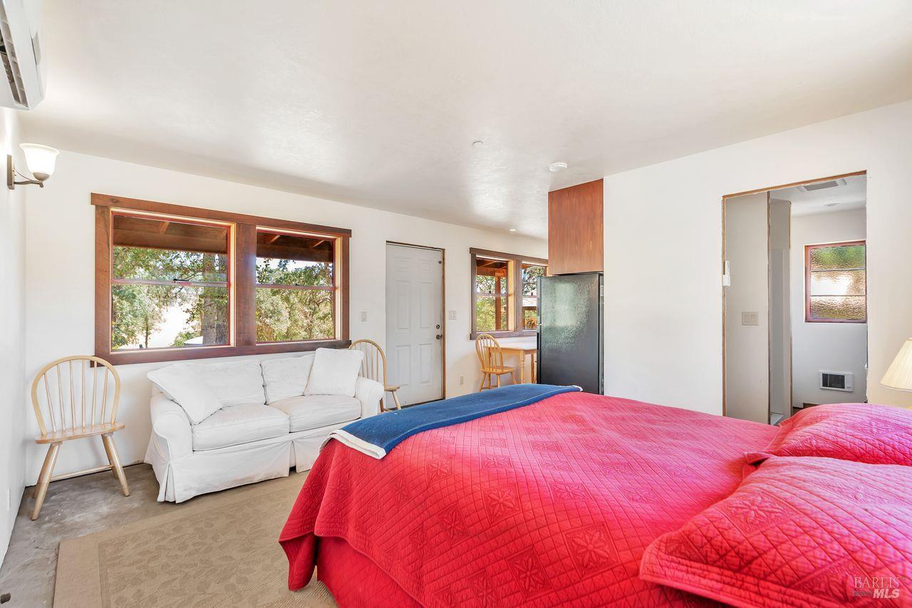 17277 Butts Canyon Road Middletown, CA 95461 - Photo 10 of 41 a bed room with a bed and a couch