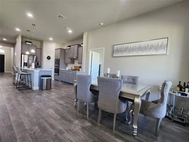 a view of a dining room with furniture