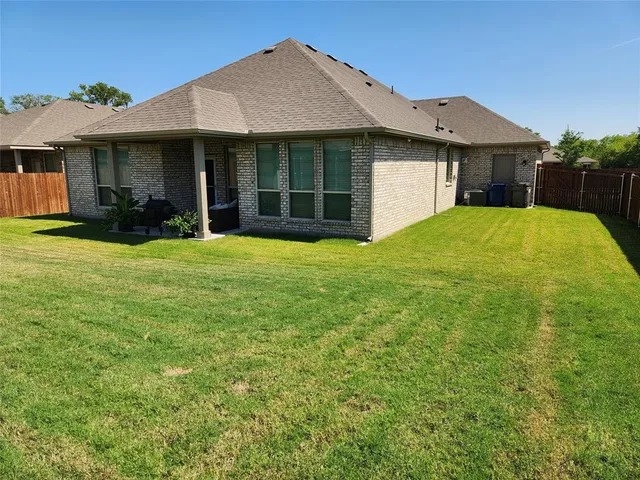 a view of a house with a garden