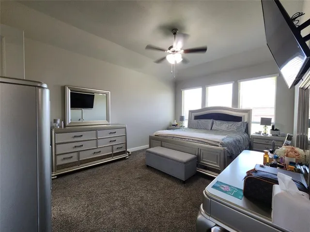 a bedroom with furniture and a chandelier