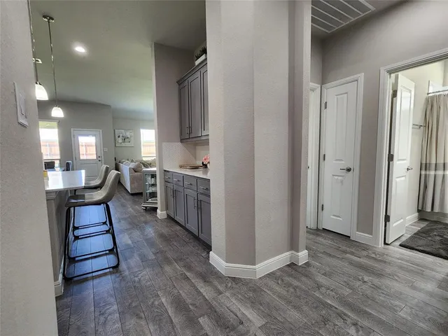 a view of kitchen with sink and wooden floor