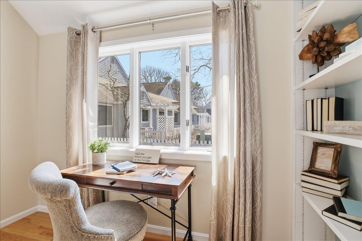 100 Mid-Iron Way, Unit 7027 Mashpee, MA 02649 - Photo 16 of 38 a view of a dining room with furniture window and outside view
