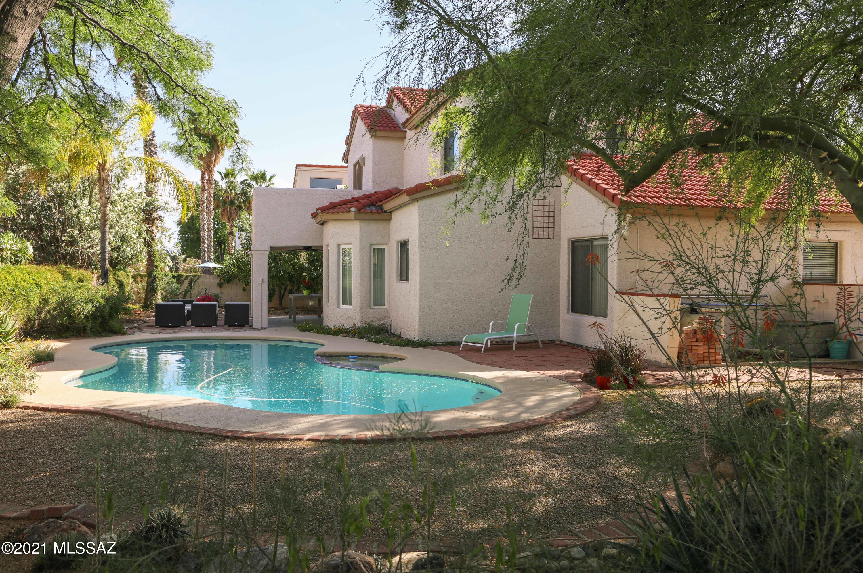 12560 North Wayfarer Way Oro Valley, AZ 85755 - Photo 15 of 43 a view of a house with pool