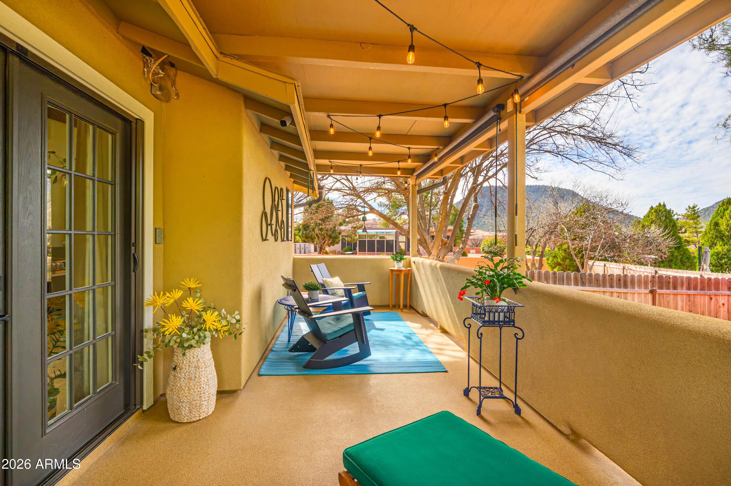 190 Creek Rock Road Sedona, AZ 86351 - Photo 27 of 41 a view of a balcony with couch and potted plants