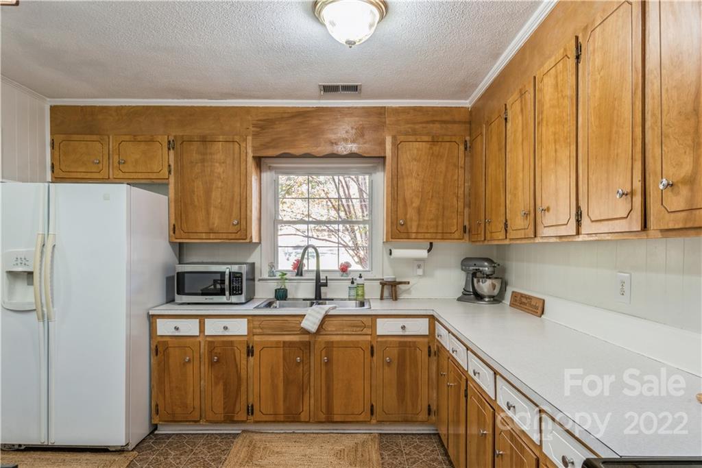 1152 Faulkner Road, Unit 1 Clover, SC 29710 - Photo 12 of 26 a kitchen with stainless steel appliances granite countertop a sink a stove and a refrigerator