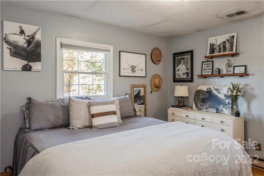 1152 Faulkner Road, Unit 1 Clover, SC 29710 - Photo 16 of 26 a bedroom with a bed and painting on the wall