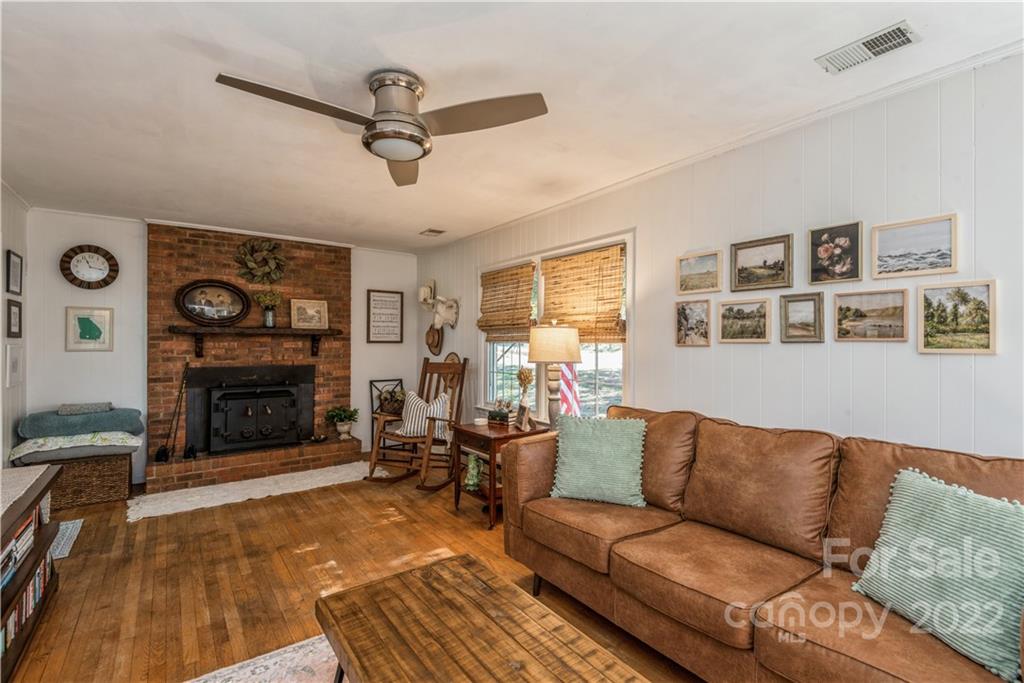 1152 Faulkner Road, Unit 1 Clover, SC 29710 - Photo 8 of 26 a living room with furniture a fireplace and a flat screen tv