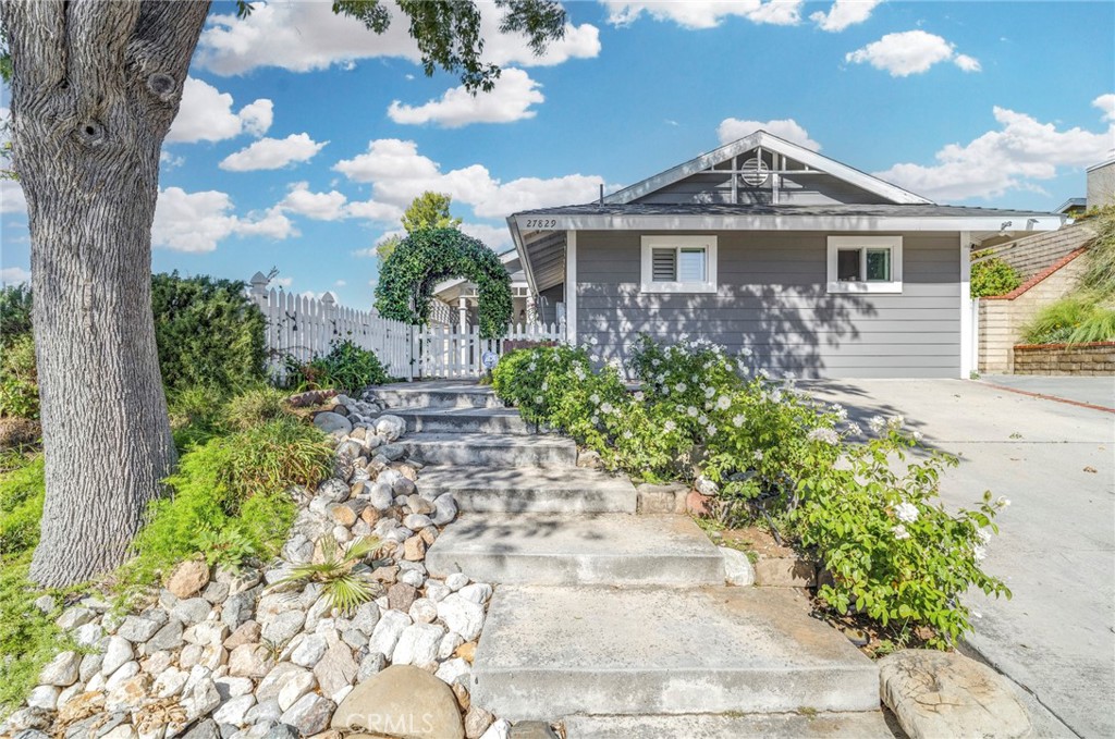 27829 Carnegie Avenue Santa Clarita, CA 91350 - Photo 1 of 46 a front view of a house with a yard