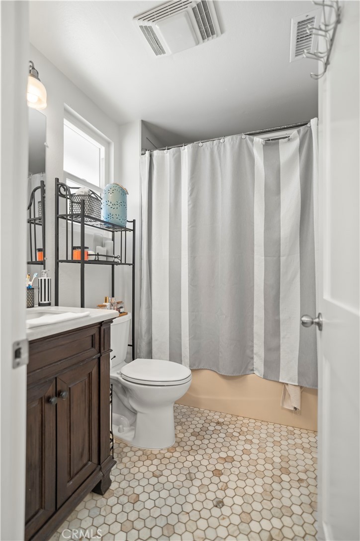 27829 Carnegie Avenue Santa Clarita, CA 91350 - Photo 25 of 46 a bathroom with a sink toilet and shower