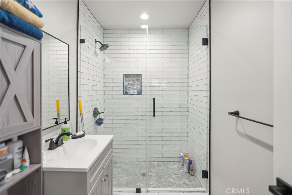 27829 Carnegie Avenue Santa Clarita, CA 91350 - Photo 35 of 46 a bathroom with a sink a toilet and shower