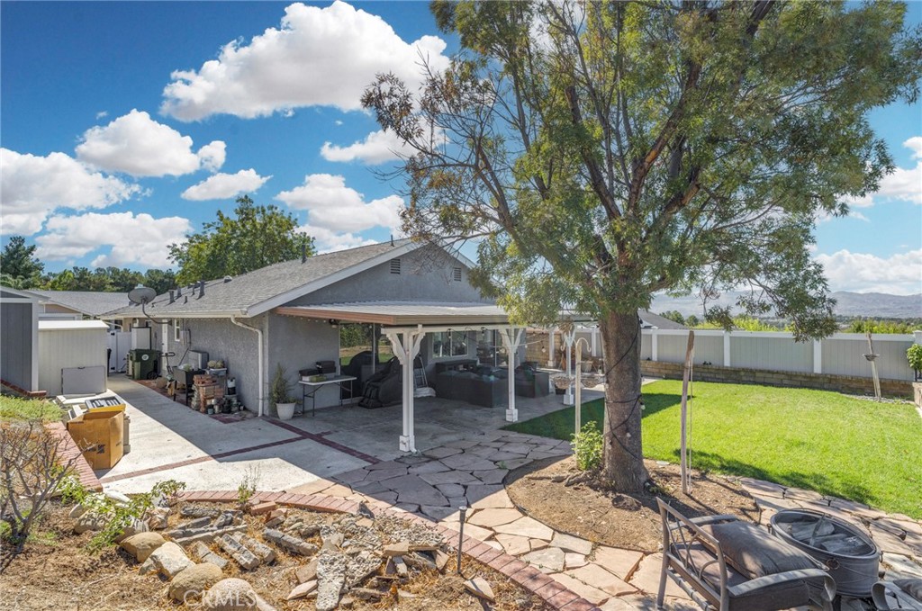 27829 Carnegie Avenue Santa Clarita, CA 91350 - Photo 46 of 46 a view of a house with backyard porch and sitting area
