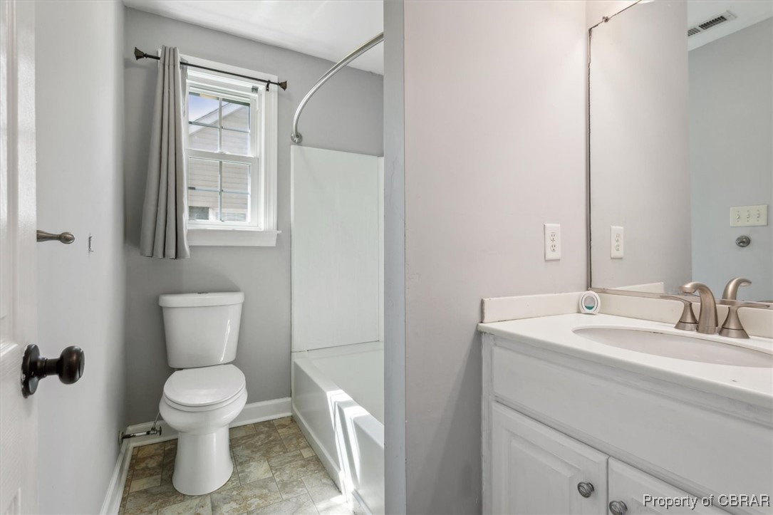3810 Kecoughtan Road Hampton, VA 23669 - Photo 30 of 40 Full bathroom featuring vanity, toilet, and shower combination