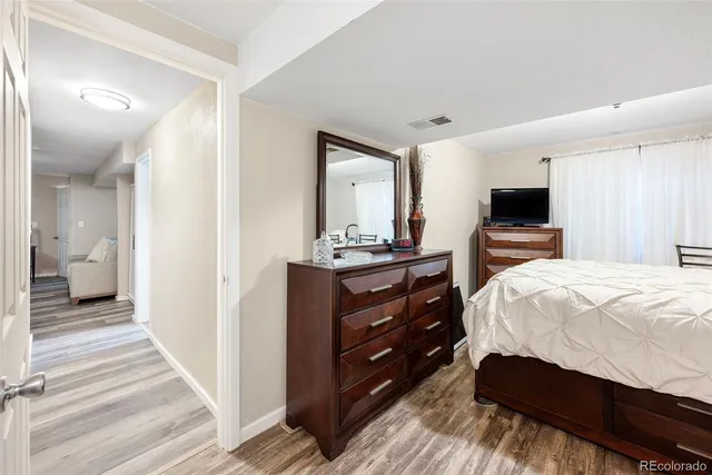 a bedroom with a large bed and tv