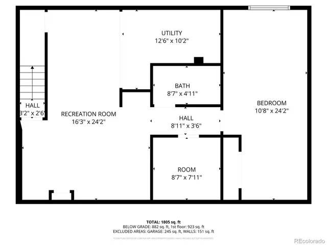 a picture of a bench in front of a wall