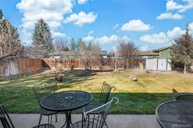 a view of a swimming pool with a table and chairs