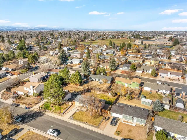an aerial view of residential building and parking space