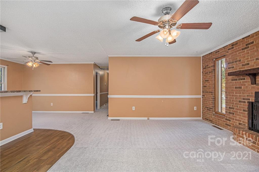 1655 Songwood Road Concord, NC 28025 - Photo 5 of 21 a view of an empty room with a ceiling fan