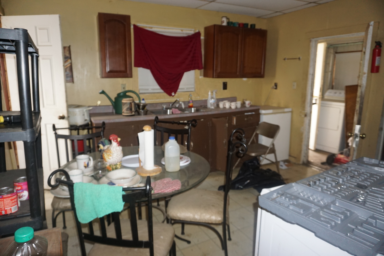 109 South Washington Sparta, IL 62286 - Photo 10 of 13 a kitchen with a table chairs and a refrigerator