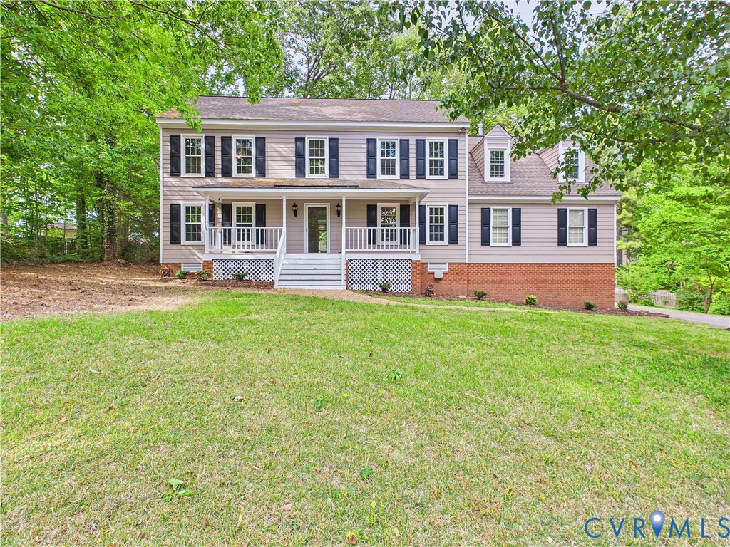 4502 Greyfield Place Chester, VA 23831 - Photo 1 of 40 a front view of a house with a yard table and chairs