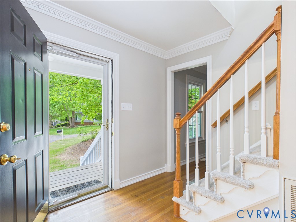 4502 Greyfield Place Chester, VA 23831 - Photo 12 of 40 a view of an entryway with wooden floor and door