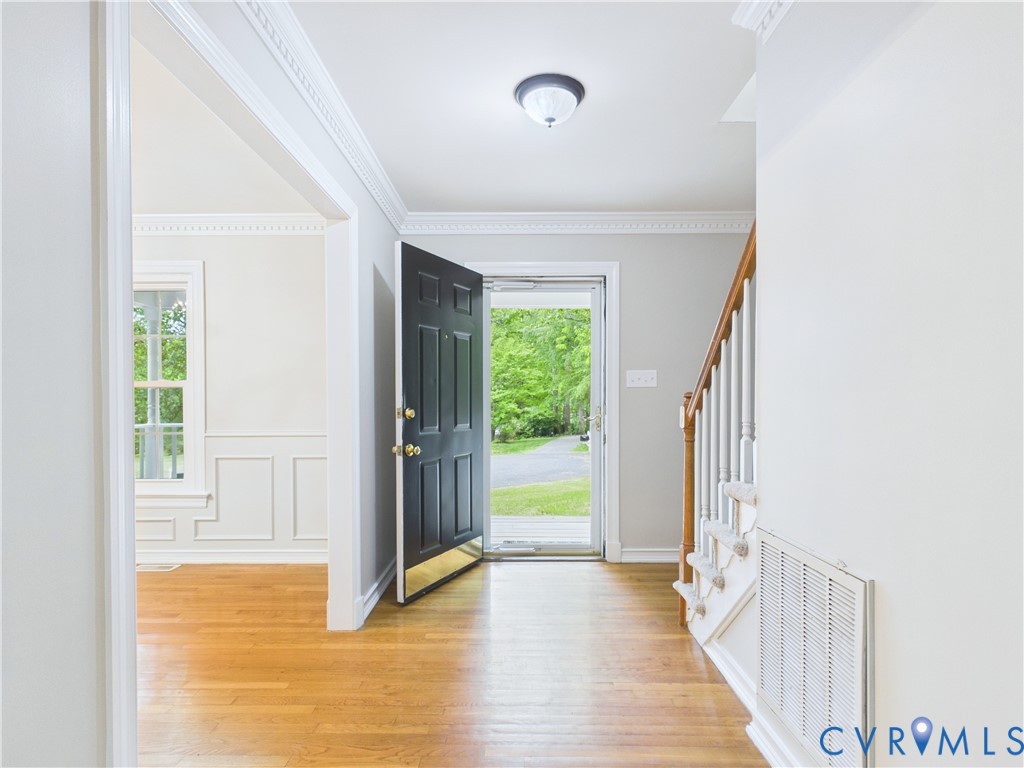 4502 Greyfield Place Chester, VA 23831 - Photo 13 of 40 a view of an entryway with wooden floor