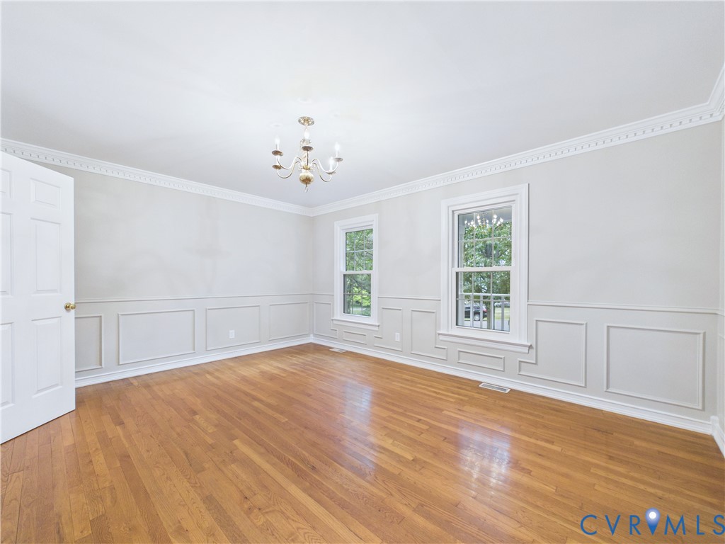 4502 Greyfield Place Chester, VA 23831 - Photo 16 of 40 wooden floor in an empty room with a window