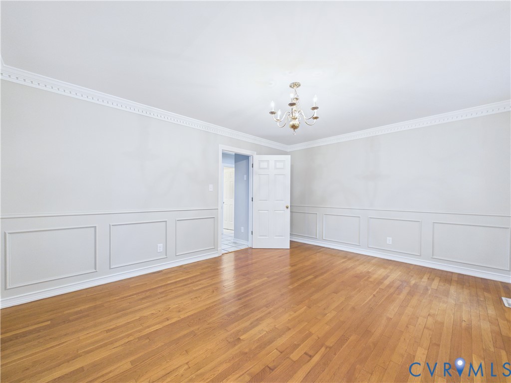 4502 Greyfield Place Chester, VA 23831 - Photo 17 of 40 a view of an empty room with wooden floor
