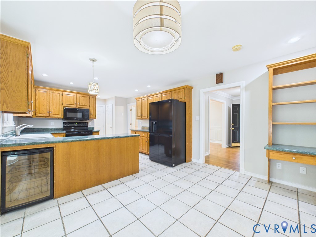 4502 Greyfield Place Chester, VA 23831 - Photo 23 of 40 a large kitchen with stainless steel appliances a refrigerator and a stove top oven