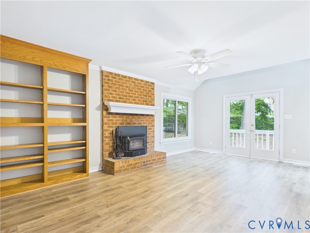 4502 Greyfield Place Chester, VA 23831 - Photo 27 of 40 a view of an empty room with a fireplace and a window