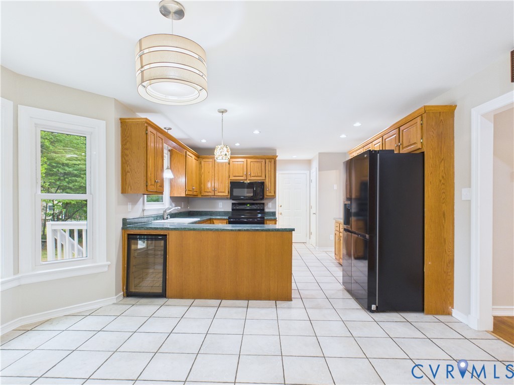 4502 Greyfield Place Chester, VA 23831 - Photo 28 of 40 a kitchen with stainless steel appliances granite countertop a refrigerator and a sink