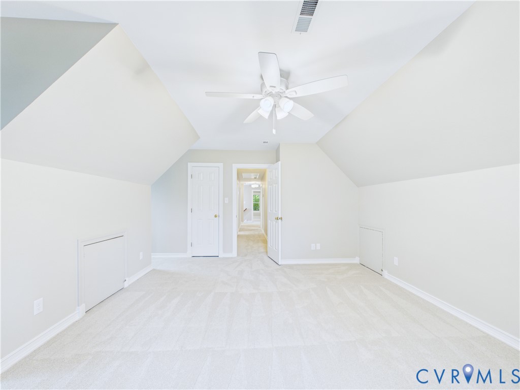 4502 Greyfield Place Chester, VA 23831 - Photo 36 of 40 an empty room with a ceiling fan and a window