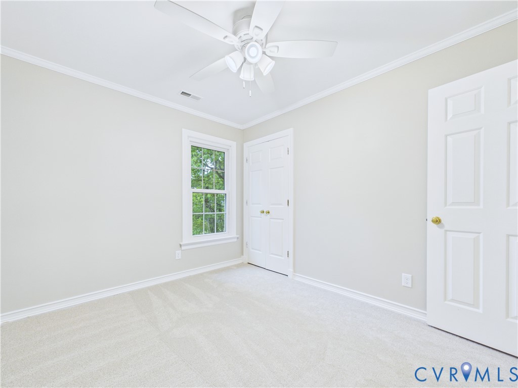 4502 Greyfield Place Chester, VA 23831 - Photo 40 of 40 an empty room with windows and ceiling fan