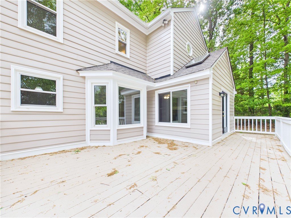 4502 Greyfield Place Chester, VA 23831 - Photo 7 of 40 a view of a house with a wooden deck