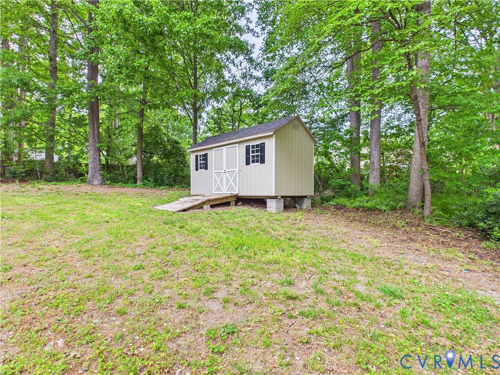 4502 Greyfield Place Chester, VA 23831 - Photo 9 of 40 a backyard of a house with lots of green space