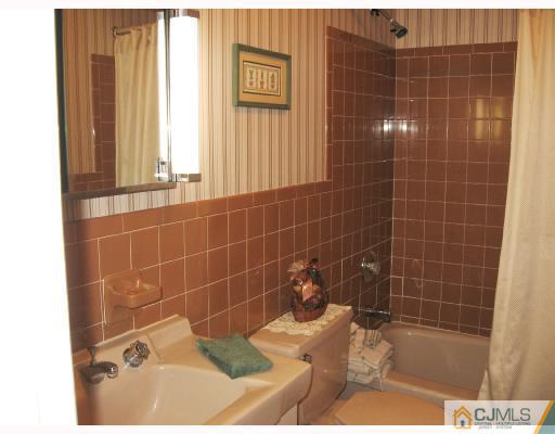 116 George Avenue Edison, NJ 08820 - Photo 6 of 8 a bathroom with a shower