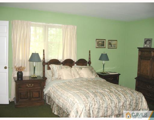 116 George Avenue Edison, NJ 08820 - Photo 7 of 8 a bedroom with bed and window