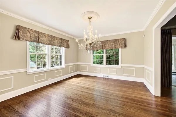 a view of a living room with wooden floor