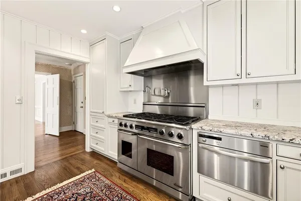a kitchen with granite countertop a sink and a window