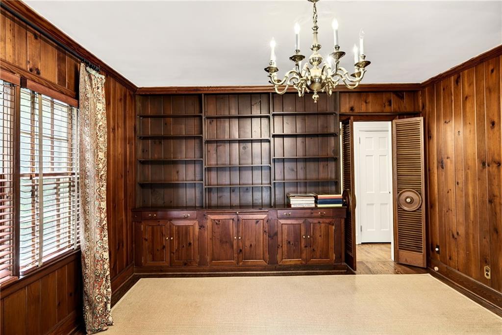 596 West Wesley Road Northwest Atlanta, GA 30305 - Photo 24 of 60 a view of a livingroom with a bookshelf