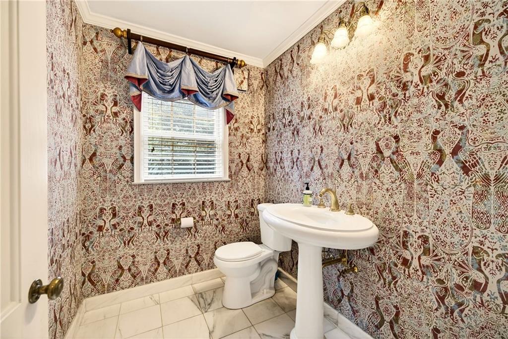 596 West Wesley Road Northwest Atlanta, GA 30305 - Photo 25 of 60 a bathroom with a toilet and a shower curtain