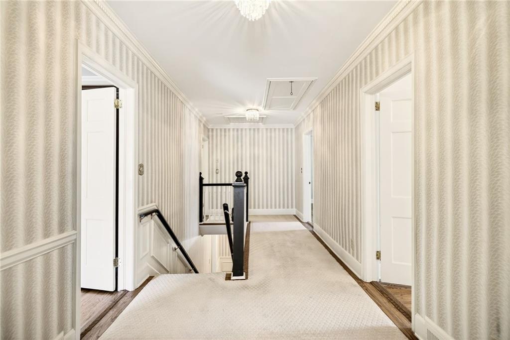 596 West Wesley Road Northwest Atlanta, GA 30305 - Photo 27 of 60 a view of a hallway with wooden floor and staircase