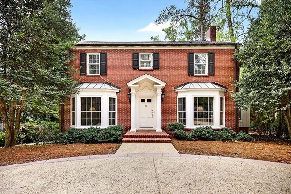 a front view of a house with yard
