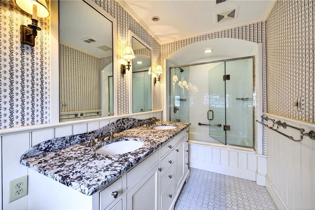 596 West Wesley Road Northwest Atlanta, GA 30305 - Photo 31 of 60 a bathroom with a granite countertop sink and a mirror
