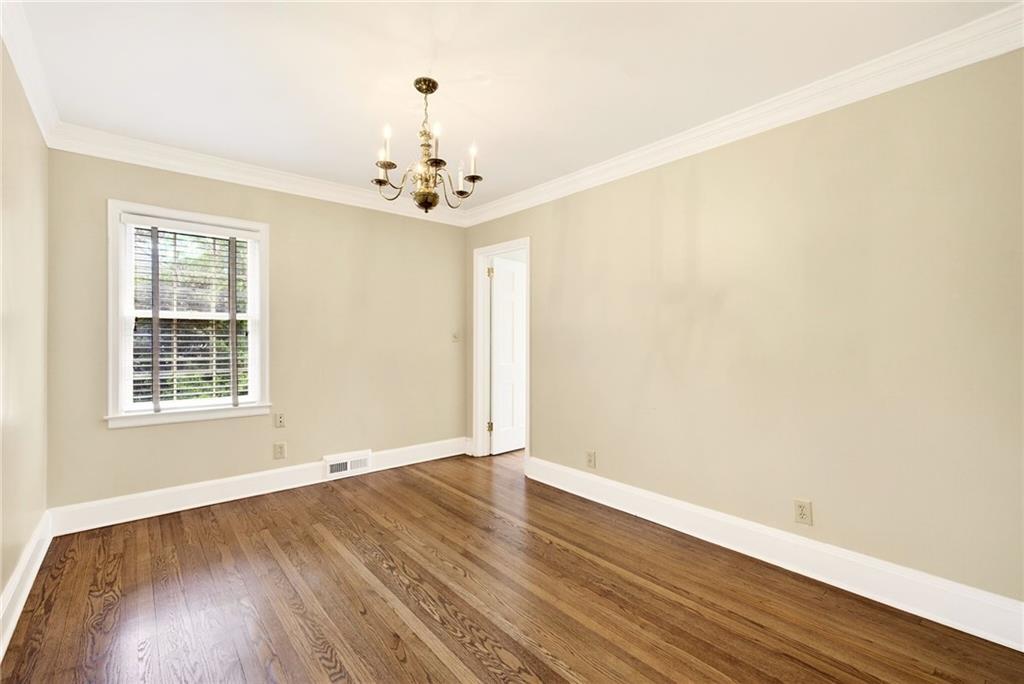 596 West Wesley Road Northwest Atlanta, GA 30305 - Photo 38 of 60 an empty room with wooden floor and window