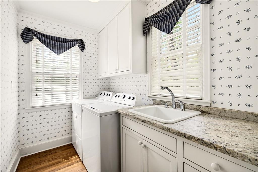 596 West Wesley Road Northwest Atlanta, GA 30305 - Photo 42 of 60 a bathroom with a sink and a mirror