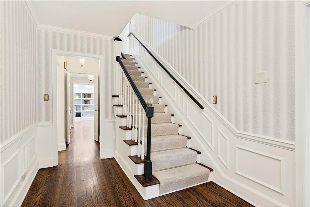 596 West Wesley Road Northwest Atlanta, GA 30305 - Photo 5 of 60 a view of entryway with wooden floor and stairs