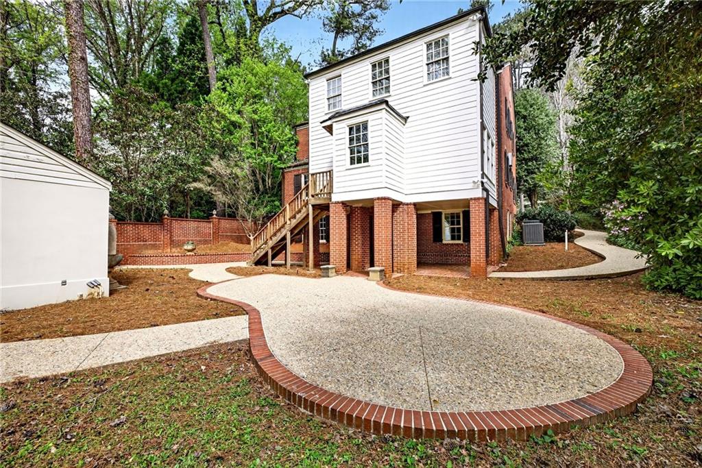 596 West Wesley Road Northwest Atlanta, GA 30305 - Photo 52 of 60 a view of a house with backyard and trees